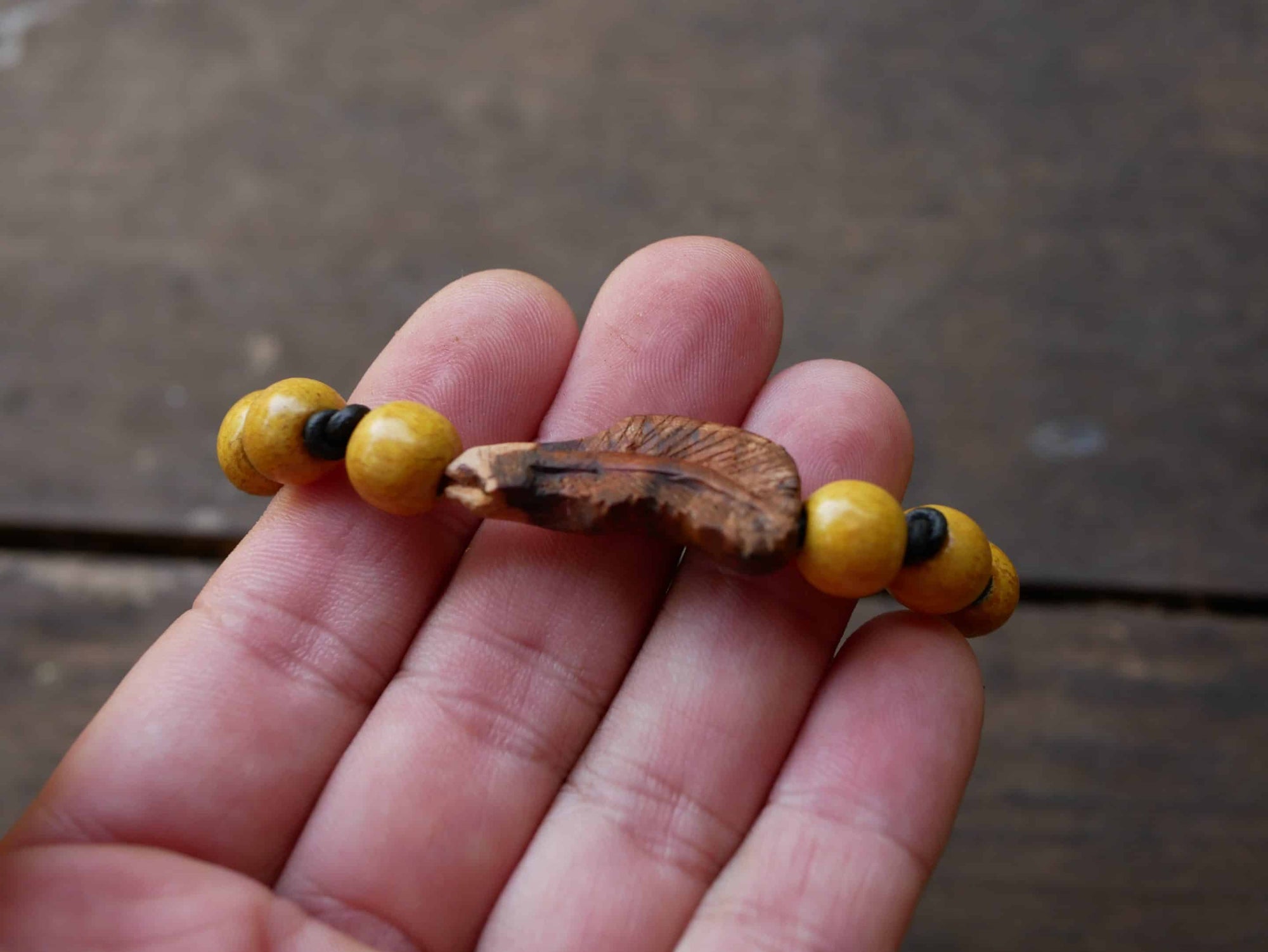 Armband Feder Baumperle